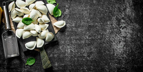 Raw dumpling. Cooking homemade dumplings with potatoes.