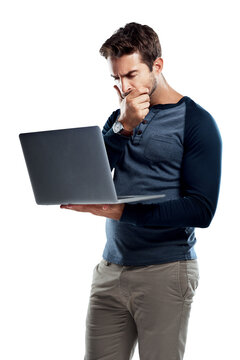 A handsome young man using a laptop and looking confused isolated on a PNG background.