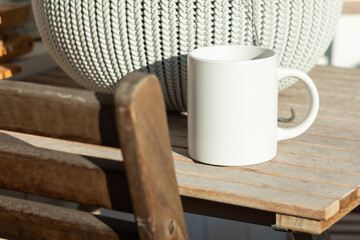 White mug on the table - 562098802