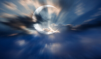Crescent moon rising over empty sea at night  