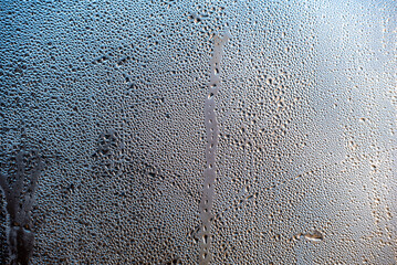 water drops on glass surface close up