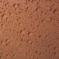 Bubbles of different sizes and shapes made of pink sparkling wine abstract whole background