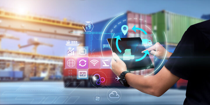 Business Logistics technology concept.Man hands using tablet on blurred cargo port as background