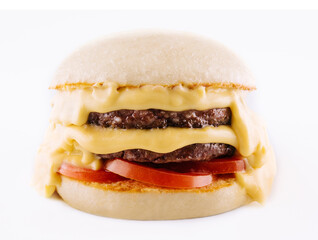 hamburger with two cutlets, tomatoes and melted cheese