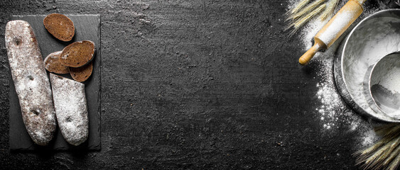 Rye bread with flour and rolling pin.