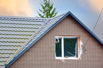 Window replacement in private house. Installing new pvc window in house. Cottage house window. .