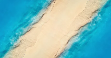 Foto op Plexiglas Aerial view of transparent blue sea with waves on the both sides  and empty sandy beach at sunset. Top view of sandbank. Summer travel in Zanzibar, Africa. Tropical landscape with white sand and ocean © den-belitsky