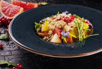 salad couscous with grapefruit and pomegranate seeds