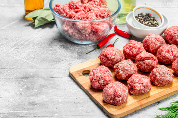 Raw beef meatballs with spices and fragrant dill .