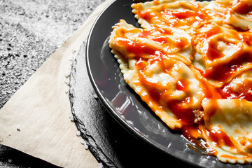 Ravioli with tomato sauce.