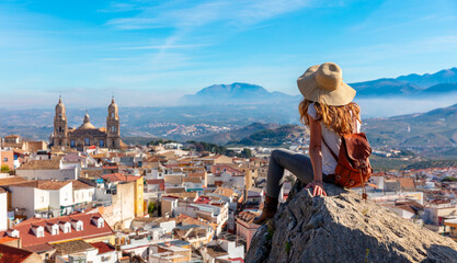 Woman tourist at Jaen, l ooking at panoramic view of the cathedral- Spain - obrazy, fototapety, plakaty