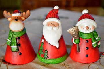 clay Christmas figurines at the table