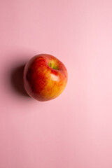 The top view of red eco tyrolese apple on the pink background 