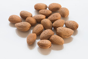 almonds in shells on white