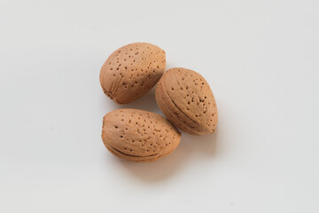 almonds in shells on white