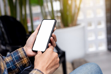 cell phone blank white screen mockup.hand holding texting using mobile on desk at office.background empty space for advertise.work people contact marketing business,technology