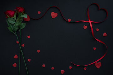 Beautiful valentines day background with red hearts and roses on black banner background. Wedding, birthday, Valentine's Day. 14 February. 
