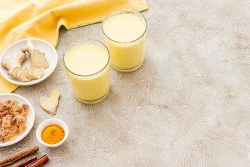 Yellow turmeric latte coffee. Golden milk with turmeric and cinnamon