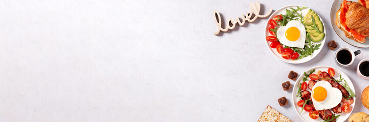 Couple breakfast border on Valentines Day on gray background, top view
