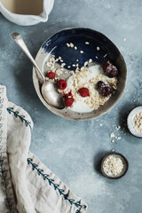 homemade yogurt bowl with raspberry, and granola - healthy food style