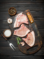 Raw pork steaks on the bone.