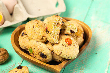 Homemade oatmeal cookies with candied fruit in a heart-shaped plate