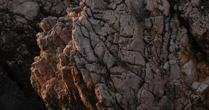  stone rocks on the shore of the adriatic sea at sunset. close-up
