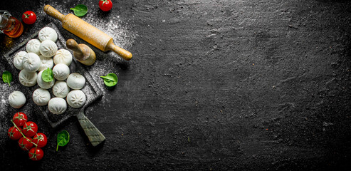 Raw manta dumpling with cherry tomatoes.