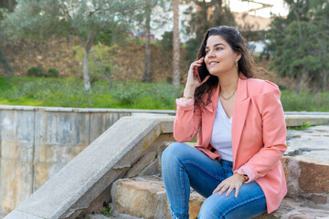 Girl talking on the phone sitting on a staircase