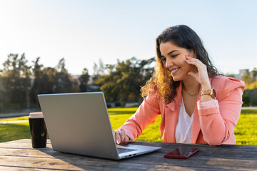 Business girl surfing the internet with her laptop.