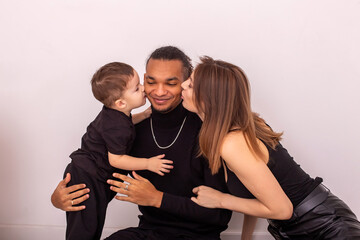 a happy family,kiss a stylish young man on both sides on the cheeks,