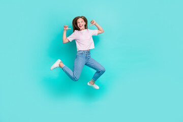 Fototapeta na wymiar Full length photo of cool funky lady wear striped t-shirt pointing thumbs herself jumping high isolated turquoise color background