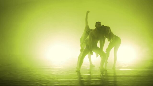 Group of young hip-hop dancers in studi with smoke