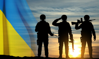 Flag of Ukraine with silhouettes of soldiers against the sunset. Armed forces of Ukraine concept. EPS10 vector