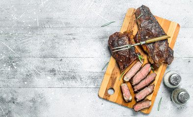 Grilled beef steak with rosemary and spices.