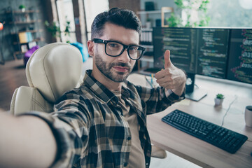 Photo of professional smart hacker guy sitting chair take selfie hand finger show thumb up...