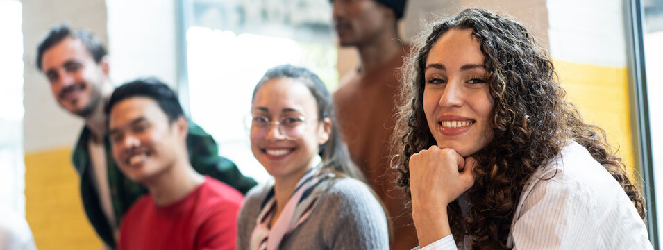 Horizontal Banner Or Header With University Students Multiethnic Team Studying Together On A New Project In Creative Coworking Classroom - Bright Filter With Focus On First Woman On Left