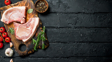 Raw pork steak on the bone with spices.