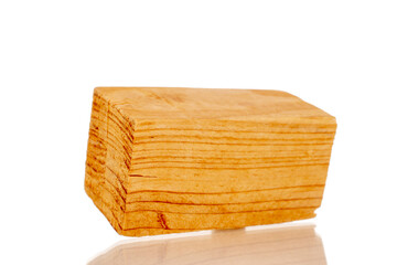 One wooden block, macro, isolated on white background.