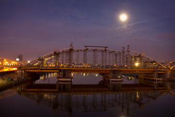 moonlit night scenery with the night lights of the bridge over the Vistula