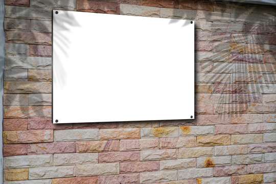 Blank picture frame on brick wall with copy space, framed poster mockup. Distressed red brick wall texture grunge background.