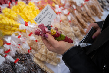 Traditional Polish candies from a stand with regional sweets in Kraków, such as miodek turecki,...