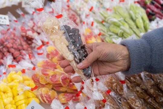 Traditional Polish candies from a stand with regional sweets in Krak&oacute;w, such as miodek turecki, trupi miodek or pańska sk&oacute;rka. Treats sold during All Saints' Day and Easter Emaus in Krakow, Poland.