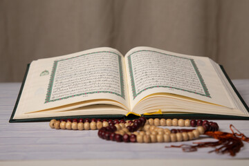Concept: open Quran book  local language holy prayers for god,Coran - holy book of Muslims religion,
Friday month of 1444 Puasa Ramadan religion Islamic worshiping faith