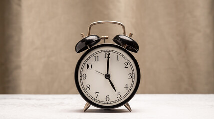 Classic black  clock old vintage alarm, 
Retro alarm clock on table , background with copy space,
Retro alarm morning