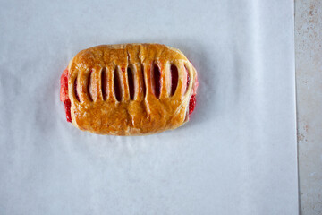 A top down view of a strawberry danish pastry.