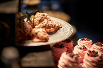 Croissants with almond cream on a beautiful plate. Confectionery.