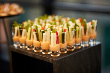 Vegetables cut into cubes in a glass with sauce. Catering 