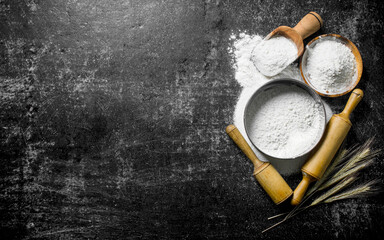 Flour with spikelets, sieve and rolling pin.