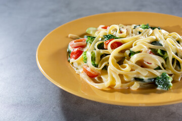 A view of a plate of fettuccine primavera.